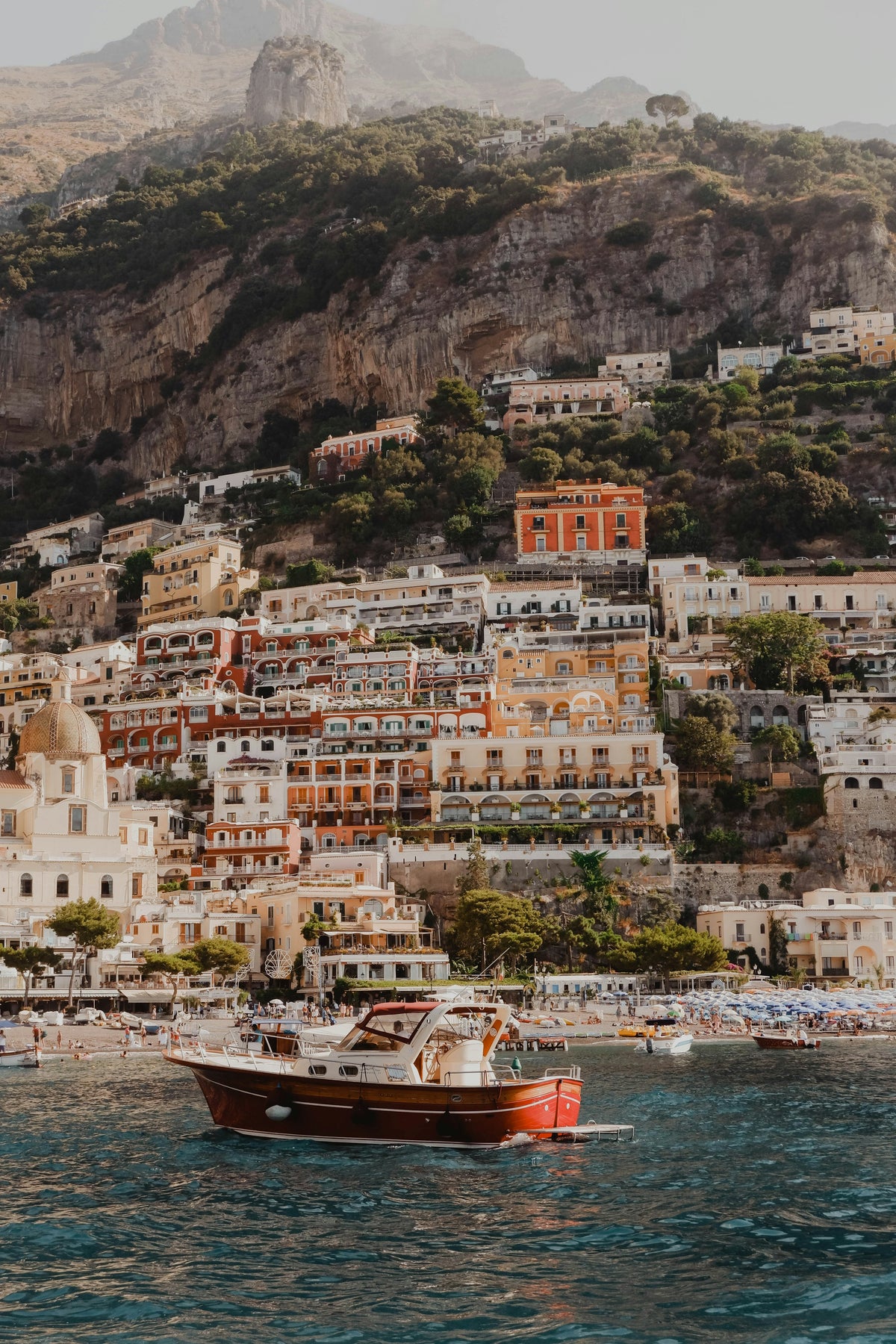 Mediterranean coastline, pale villas above the water