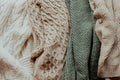 Folded knitwear in neutral tones